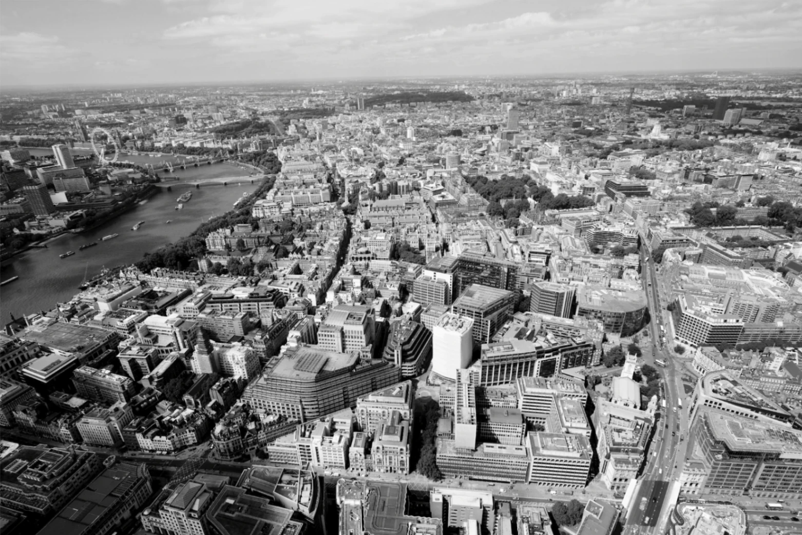 Aerial view of Central London in black and white, showing the River Thames, Westminster, the London Eye and the City skyline — illustrating ELLNO's construction advisory work across Westminster, Camden, Kensington & Chelsea and the City of London